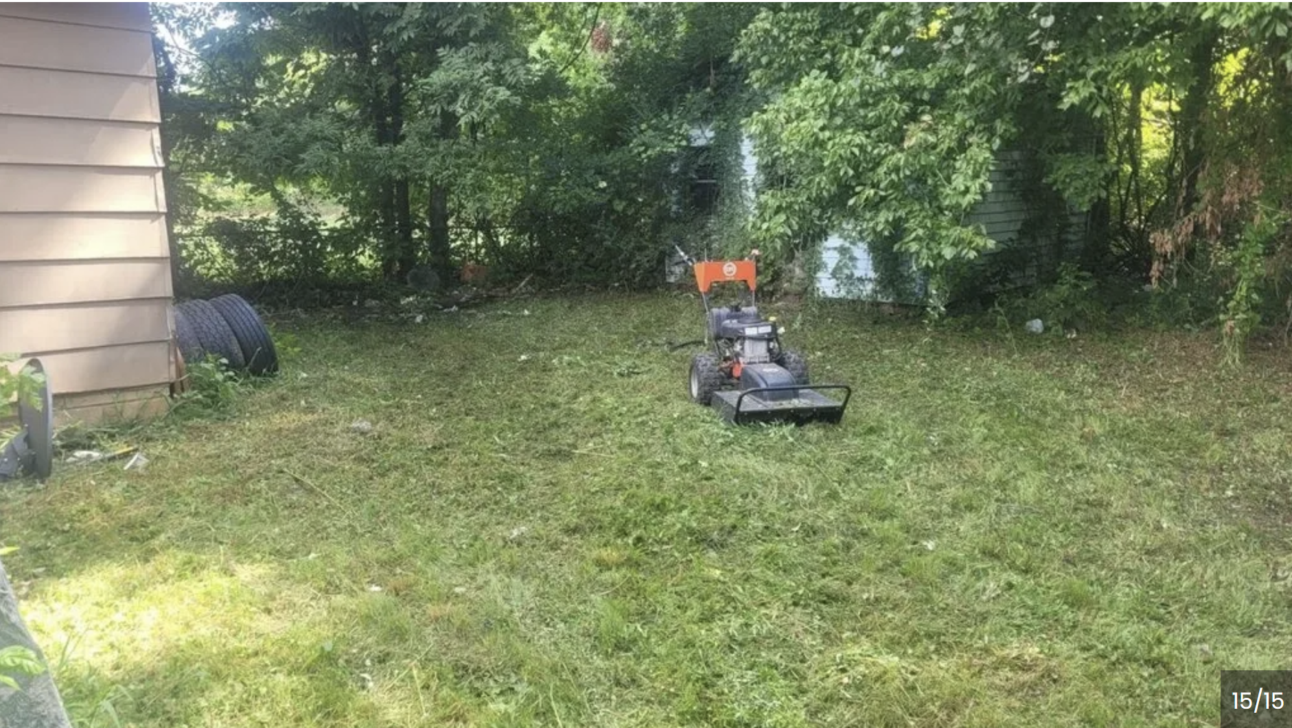 Clean residential lot after walk-behind brush cutting by Brush Brothers